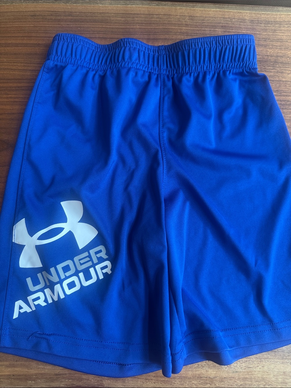 Under Armour boy’s Blue Athletic Shorts with White Logo